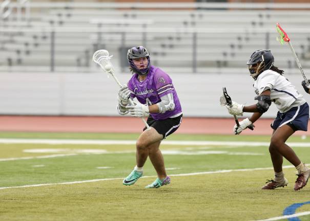 Ryan Behringer #4, attacks the Goldbacks defense
