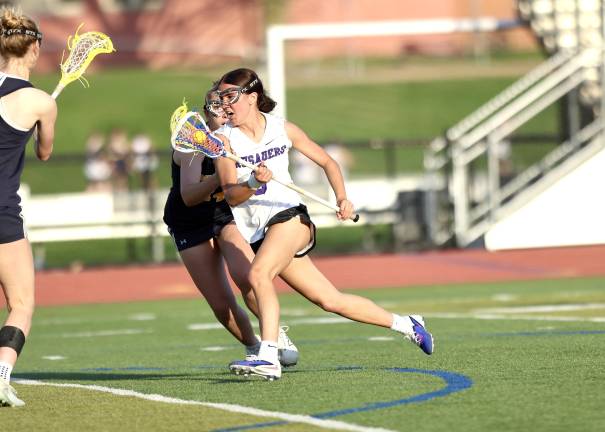 #2, Riley Colligan cuts past a Bushmen defender.