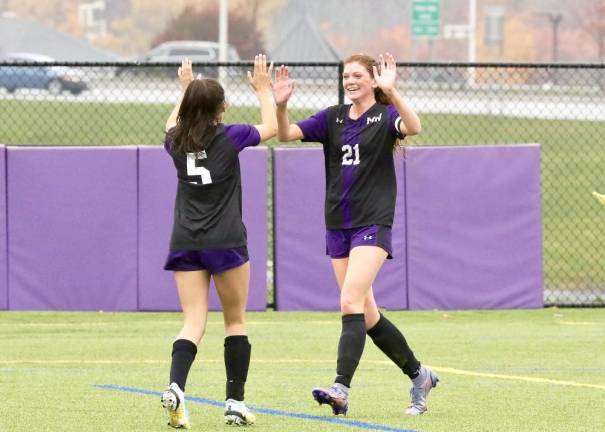 Emily McGee #21, celebrates her goal with Donovan in the second half.