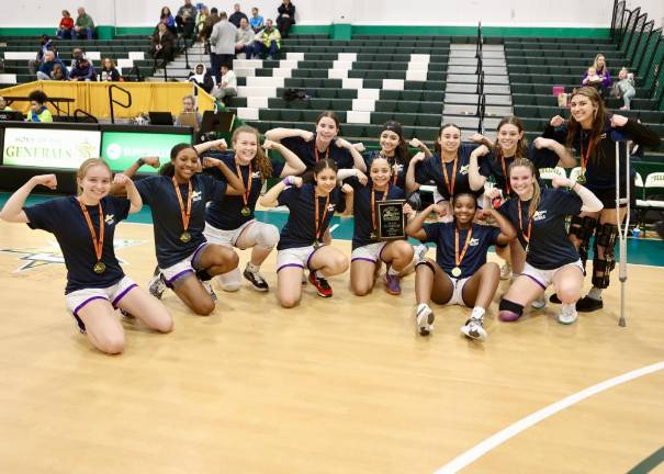 The Crusaders flex their muscles after winning the Section 9 AA Title.