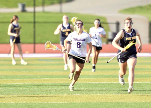 #6, Kyra Gilligan lead the Crusader come-back victory scoring five goals in the second half.