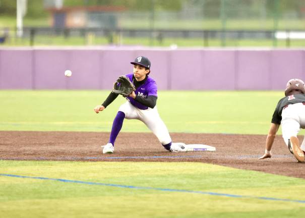 #2 Ryan Lugo waits for the throw from Bauer to tag out the Tiger runner at second.