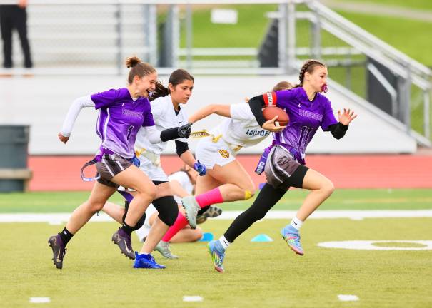 #11, Natlie Beers led the Crusaders offense this year with 3125 combined passing and rushing yardage this season.