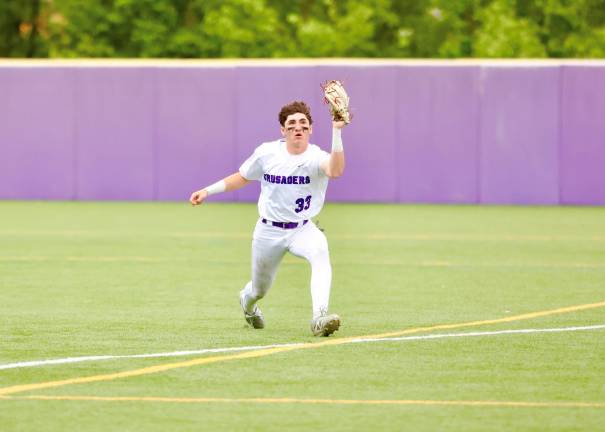 #33, Connor McHale makes a beautiful running catch near the right field foul line.