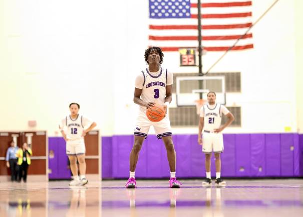 Fabrice Ndja, #3, on the foul line. He scored 10 points in the game.