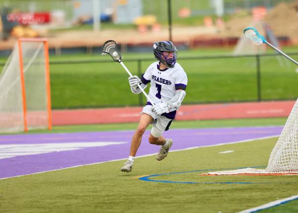-#7 CJ Henderson brings the ball out from behind the Raiders goal.