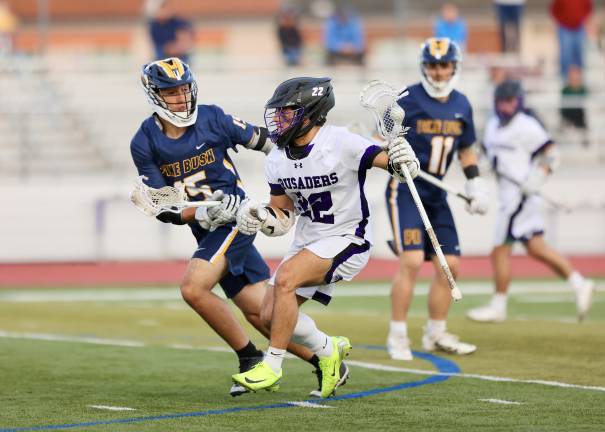 Anthony Severo #22, works past a Bushmen defender.