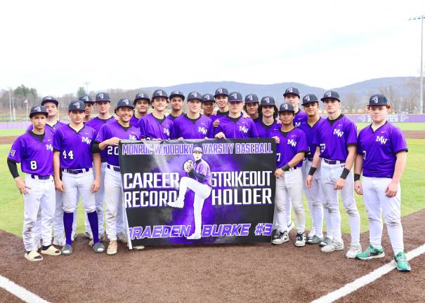Crusader Baseball team celebrates Braeden Burke’s (center) breaking the Crusader all time strikeout record.