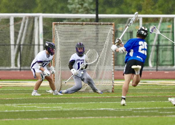 Crusader Goalie Tyler Baisley makes one of his 10 saves in the game
