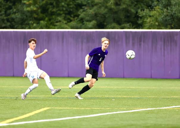 #5, William Calohan watches his first goal of the game head for the Viking net.