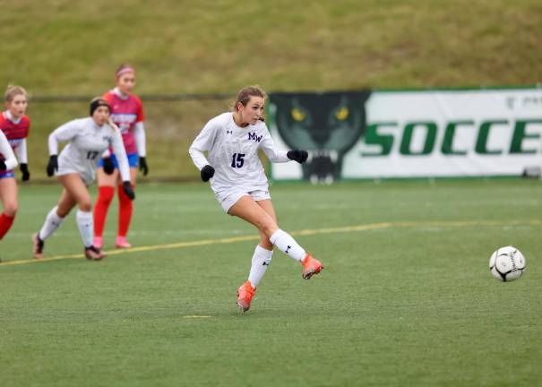 Kate Allen (#15) scores a goal on this penalty kick to give the Crusaders the semi-final victory.