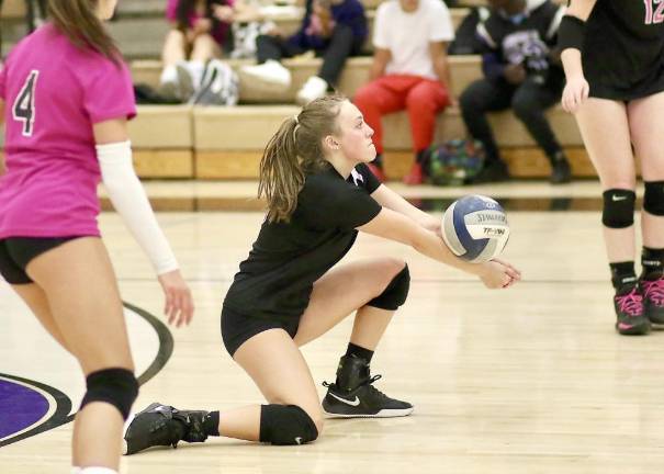 Kacie Burke, #6, dives to return a Bushmen shot in the third set.