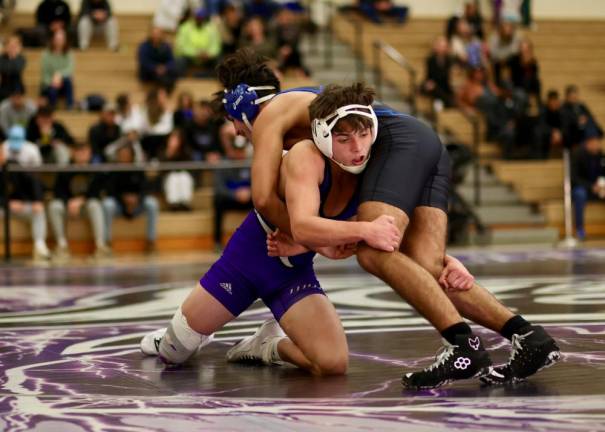 Liam Hayes (bottom) takes down his Middie opponent on his way to a 20-5 tech-fall victory.