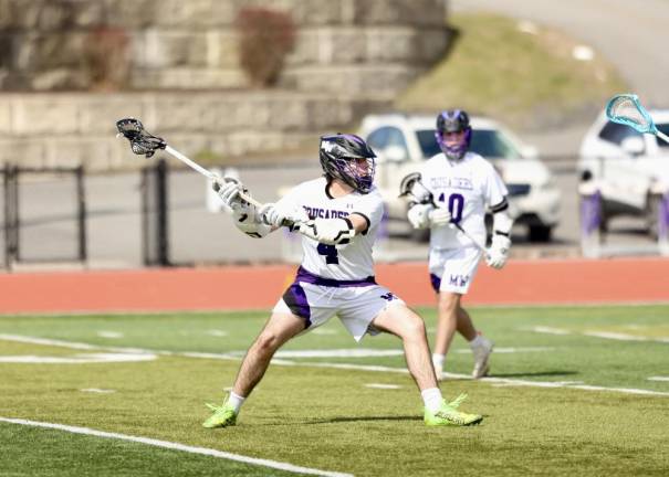 Ryan Behringer, #4, scored four goals during the game.