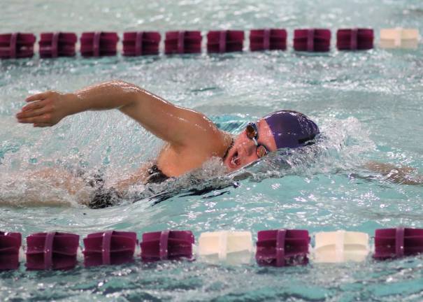 Mackenzie Tuttle took first in 100 and 200 freestyle races.