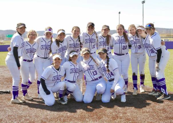 The 2022 Crusaders Varsity Softball team celebrates their opening day victory