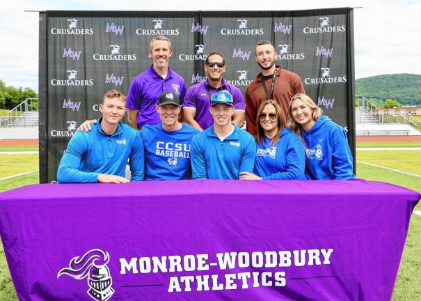 Kyle McDermott (center) and his family seated with coaches James Hahn, Christopher Vero and Anthony Amoroso. McDermott will play baseball for Central Connecticut State University next year.