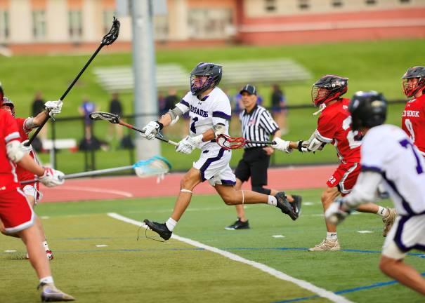 #1 Gavin Fitzgibbon won eight of the 11 face-offs in the game to help the Crusders control the game.