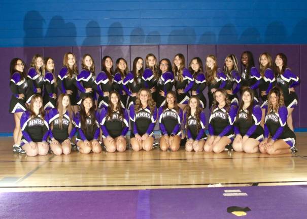 Monroe. Crusader wrestlers and cheerleaders head toward their big competitions next month