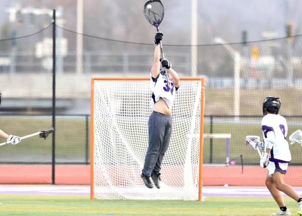 Crusader goalie #30 Chadwick Kistler makes one of his eleven saves in the game.