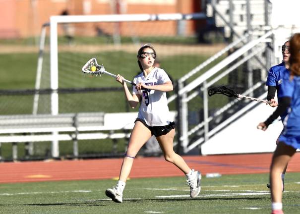 Jocelyn Rustananik looks to make a pass from behind the Middies goal.