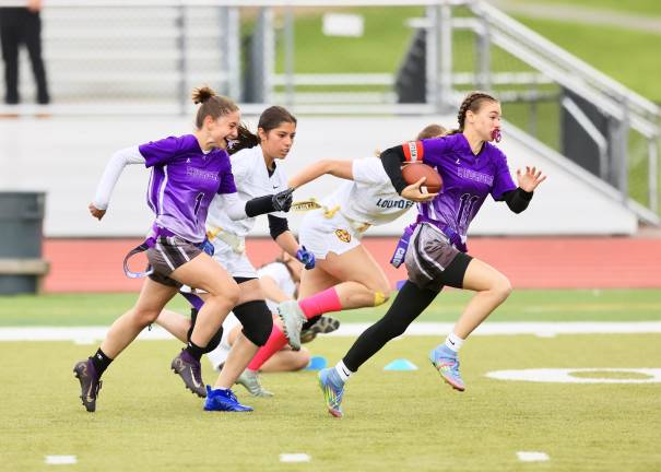 Speedy QB #11, Natalie Beers takes off on a 60-yard TD run in the fourth quarter.