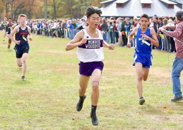 Andrew Yi gives an all-out effort as he comes to the finish line.