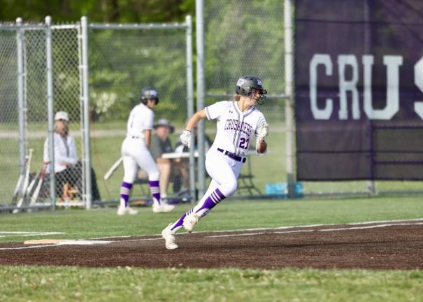 Olivia Shippee rounds first after hitting a double in the opening inning.