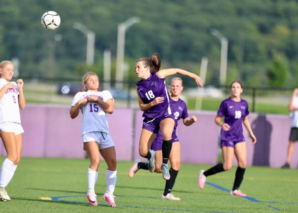 #18, Noa Siber directs the ball at the Wildcat net with her head.