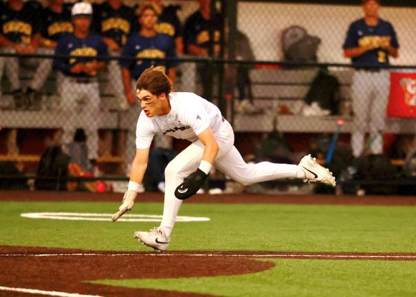 Liam Hayes sprints for home as he scores in the fourth inning.