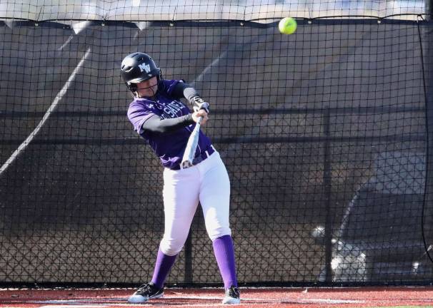 Emma Lawson (#27) launches her second homerun of the game deep to center field.