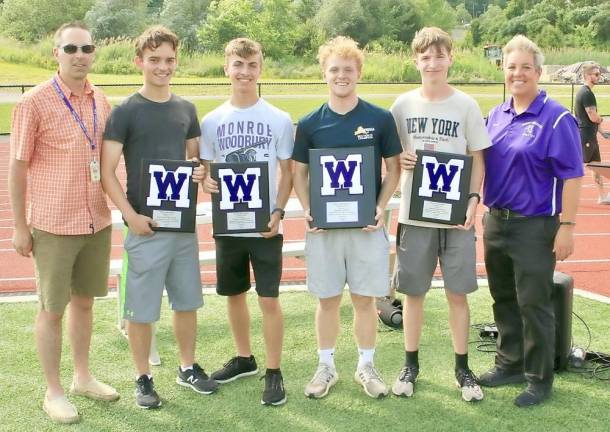 Varsity Club Inductees Matthew Bezdicek, Tyler Anderson, Keith Allen and Brian Whitfield are presented their awards from Coach Matthew Hemmer and Athletic Director Lori Hock.