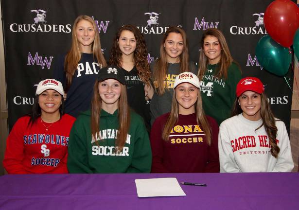 Photo provided by Monroe-Woodbury High School Eight Monroe-Woodbury High School varsity athletes signed national letters of intent during a ceremony at Monroe-Woodbury High School with friends, family and members of the Monroe-Woodbury administration and staff in attendance. Beginning in front, from left to right are: Hannah Geller, Sydney Harwood, Katie Benson and Brianna DeGennaro; and in back: Annabella Campagna, Kerry-Anne Maher, Grace Incledon and Brianna DeLeo.