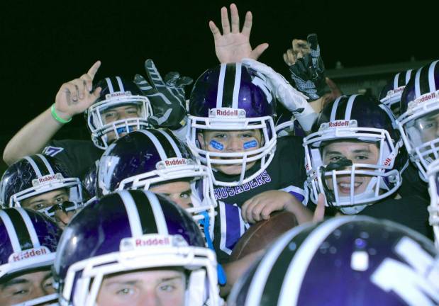 The Crusaders hoist Anthony up on their shoulders after his 40-yard touchdown scamper.