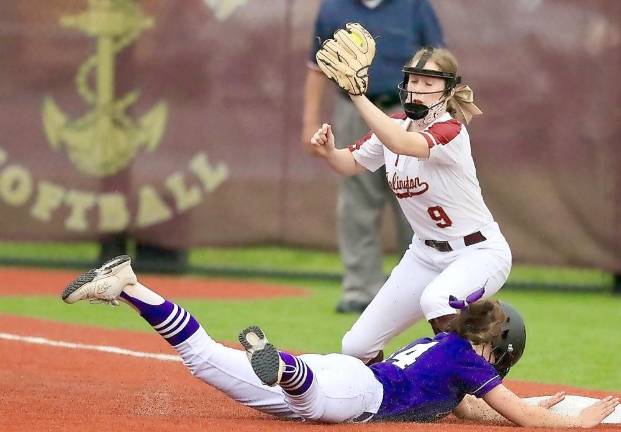 Effort: Brianna Roberts dives head first into third base with the game-winning triple in the sixth inning.