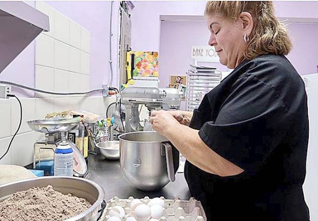 Sharyn Sherman, aka The Cake Lady, doing what she loves: making desserts for people. Provided photos.