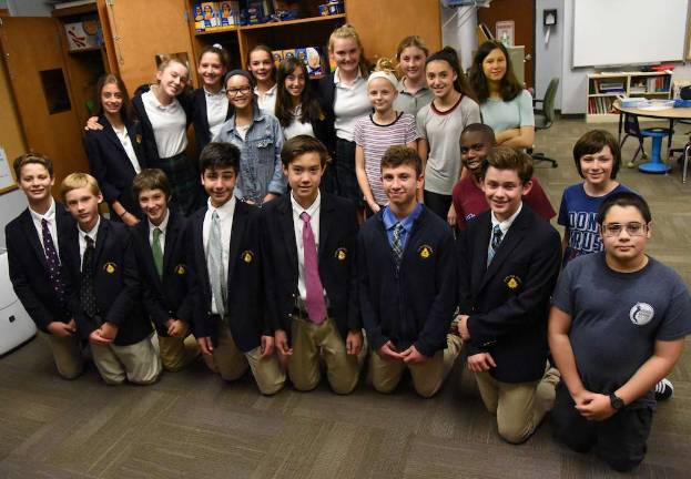 Photo by Christopher Kasker, Tuxedo Park School Tuxedo Park School eighth and ninth-grade students and George F. Baker High School eighth-grade students pose for a photo after stocking a food pantry in George Grant Mason School. Tuxedo Park School families donated the items as a community service project to support the Tuxedo District’s BackPack program.