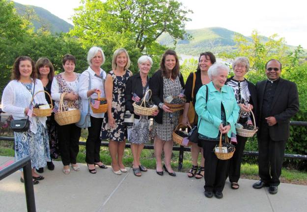 Photo provided by Nancy Bourke Ranger Rosary makers from Our Lady of Mount Carmel Church in Tuxedo gave 400 handmade Ranger Rosaries to the West Point graduates this year. Pictured from left to right are: Patrice Gesner, Letizia Rachmiel, Jenny Giusto, Diane Petrosky, Nancy Bourke, Eileen Hogan, Donna Burke, Debbie Buono, Pat Brennan, Lynda Petrillo and the Rev. Joseph Emmanuel.