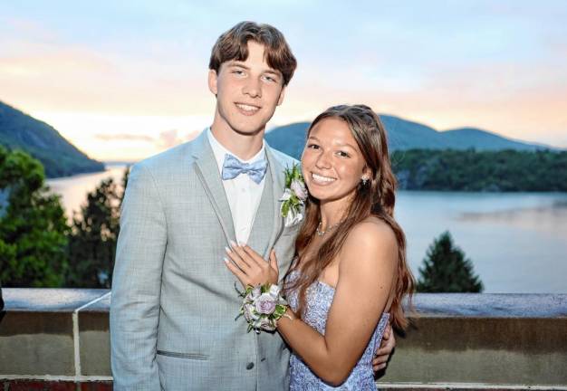 Sean Brophy and Mia Menzzasalma on the balcony at Eisenhower Hall after the rain.