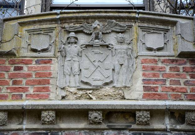 The Seal of the City of New York - complete with windmill, beavers, a flour barrel, an eagle and a Native American and a European settler - adorns the front entrance of the main building at Camp LaGuardia in Chester. Courtesy of Robert Yasinsac and his website, Hudson Valley Ruins.