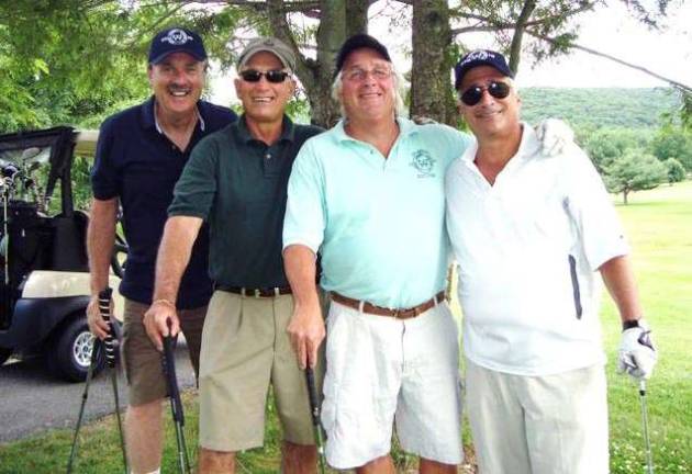 The Woodbury Community Association's annual Woodbury Golf Open promises a good time for players from throughout the area. Here, (l-r) Bill Doherty, Dave Levinson, Charlie Knuth and Ralph Forgacs enjoy a laugh during last year's tournament. Proceeds go to benefit the people of Woodbury. This year's event is on Friday, June 8, at the Falkirk Golf Club in Central Valley.