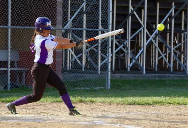 Desiree Lynch drives a single up the middle.