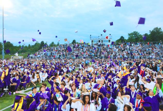 The Class of 2026 throws their hats in the air as the graduation comes to an end.