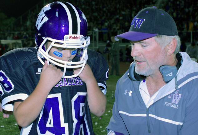 Photos by William Dimmit Anthony Scancarello and Head Coach Jimmy Hintze go over the play.