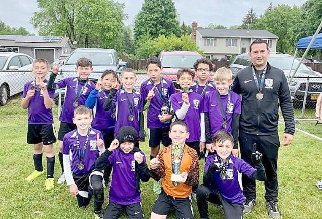 Members of the MWUSC U10 Warriors are, beginning in the back row: Christian Agius, Matt DiBenedetto, Ben Cho, Drew Orhen, Colin Smith, Jacob Massih, Evan Robertson, Austin Bernsley and Coach Mike DeGiglio; and in front: Tyler Mancuso, JP Donelan, Dominick DeGiglio and Carter Evans. Not pictured are Ahmed Cela, Dominick Santopietro, Emmet Schepps, Logan Fontana, Owen Farrell, Pedro Pizzoferrato, Sean Hassler, Coach Brendan Mullan and Coach Pete Magazino.