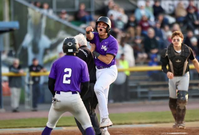 Michael Monda shows his emotion as he scores in the first inning