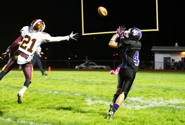 Photo by Don Beeler Justin Kaffenberger is about to catch one of his seven receptions in Monroe-Woodbury's 27-14 homecoming victory against Kingston High School last Friday evening.