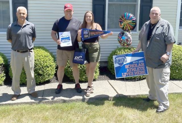 Tuxedo Schools Superintendent Timothy Bohlke and Athletic Director John Landro give the District’s OCIAA Scholar Athlete Award to Emma Maynard. (Provided photos).