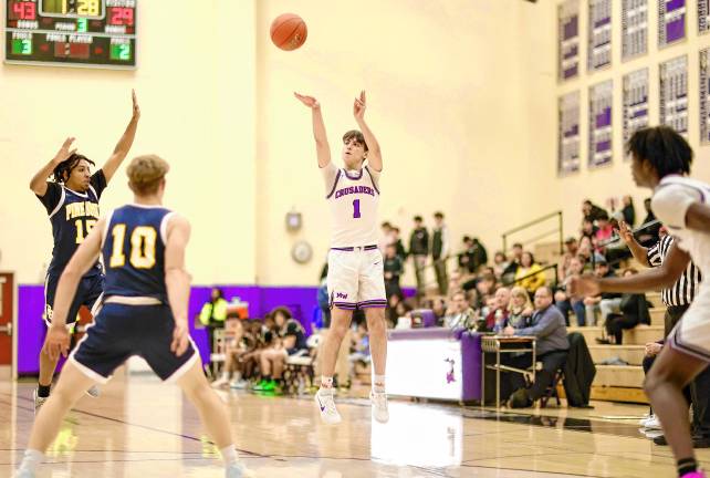 Jamie Reich, #1, led the Crusaders with 25 points in the game.
