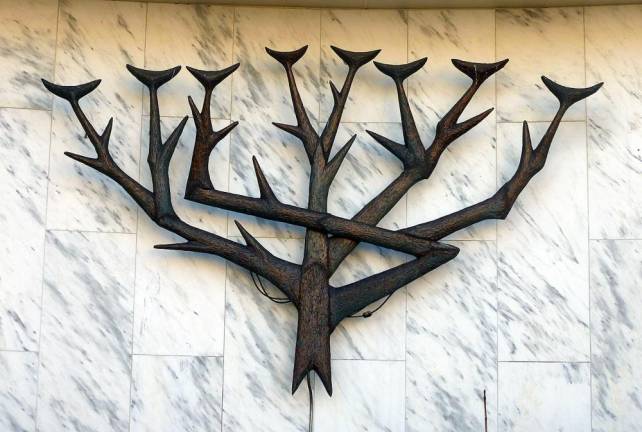 Detailed view of a menorah adorning the north wall of Montefiore Synagogue. Located at 460 Westford Street Lowell, Massachusetts.